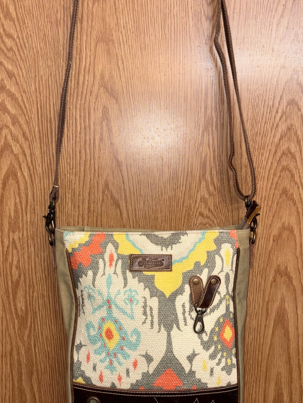 Sixtease Crossbody Bag